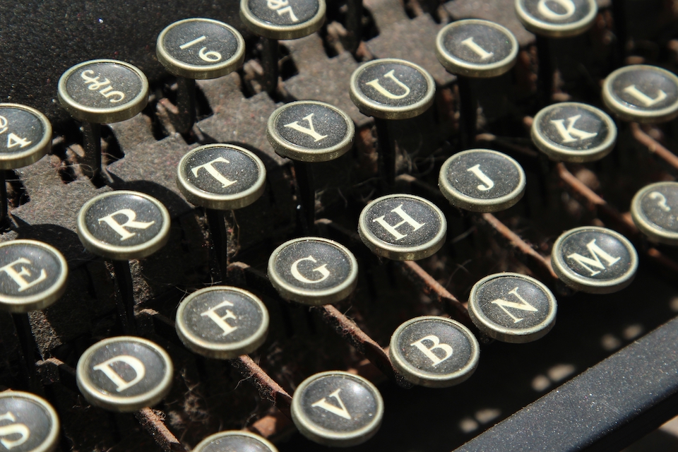 A closeup shot of a vintage typewriter keys